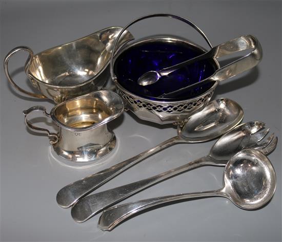 A small silver cream jug, crested (1904 inscription), silver sugar tongs and sundry plated items.